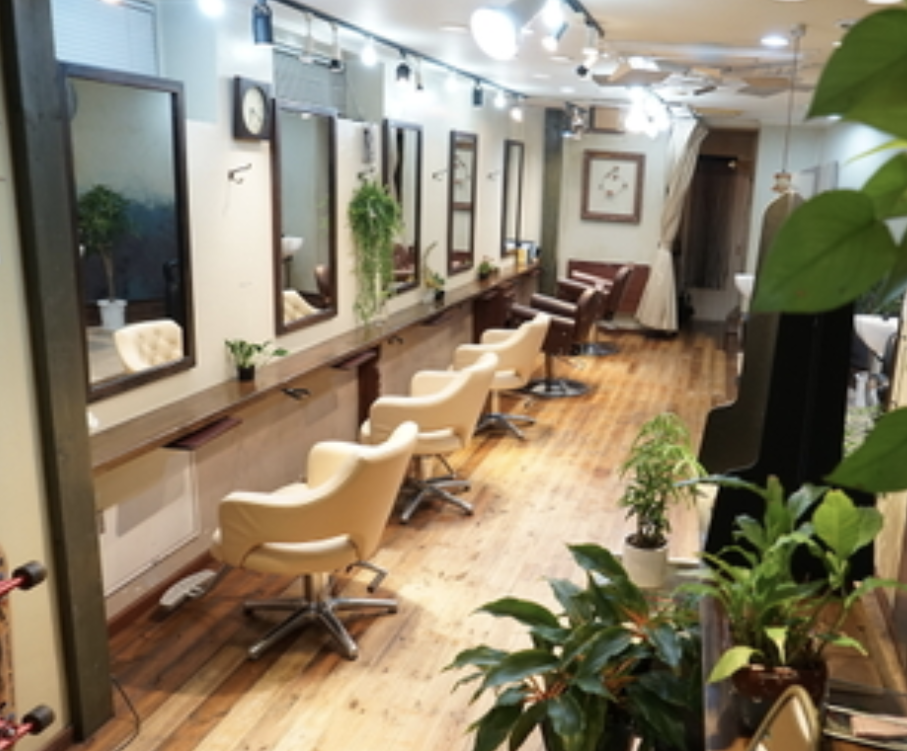 Before — old salon floor with styling chairs