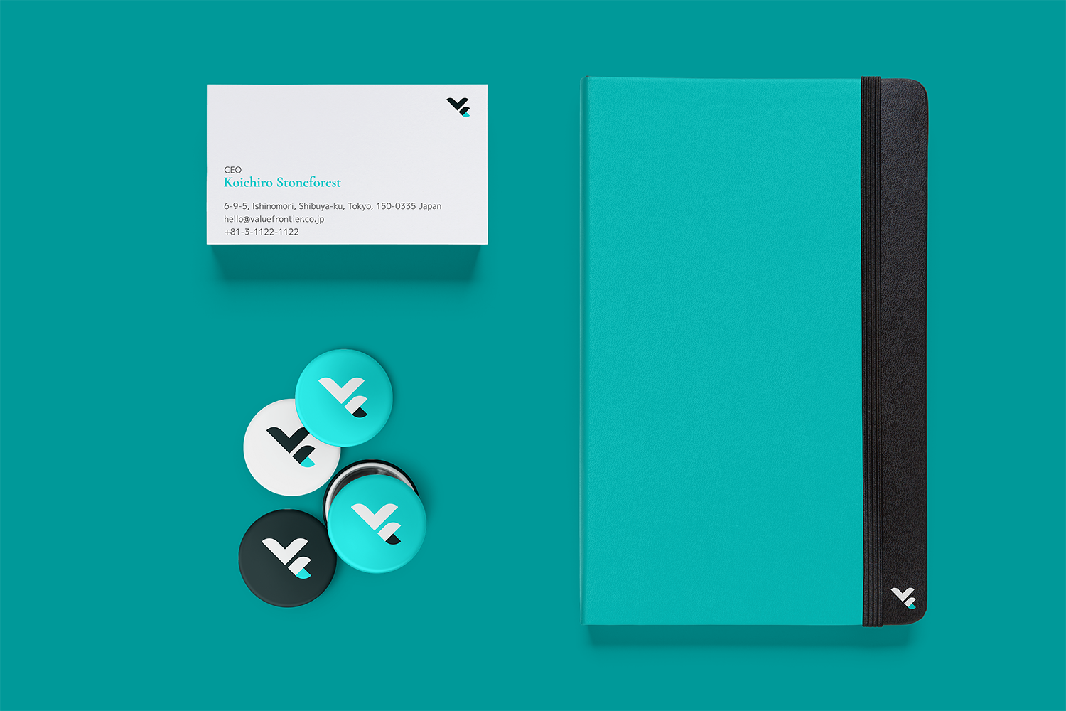 Value Frontier business cards, pins, and notebook