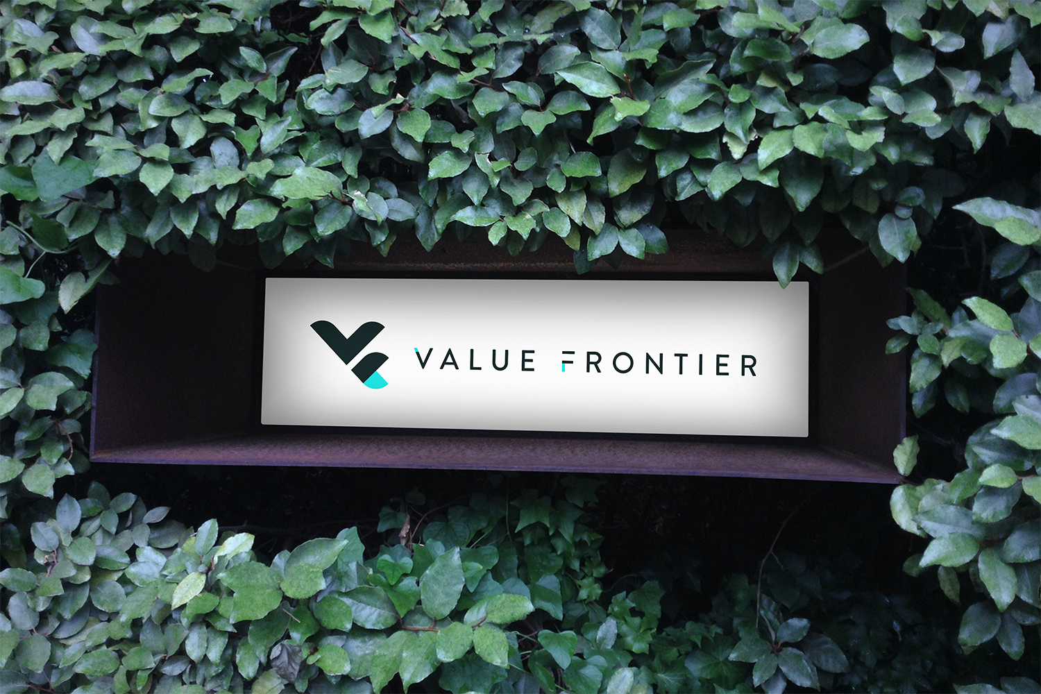Value Frontier office signage in greenery